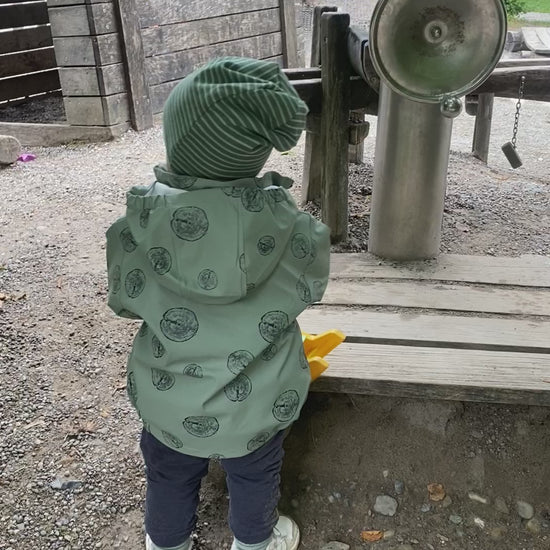 Fleece lined Beanie, rain jacket, green, video on kid wearing the beanie and unlined rain jacket 